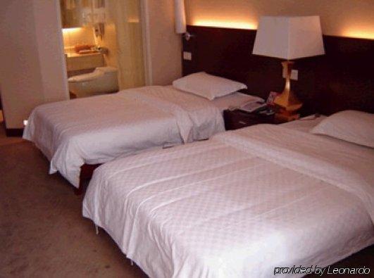Bluesky Hotel Canton Chambre photo